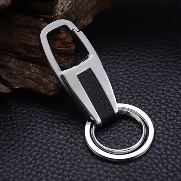 Material: zinc alloy Process: electroplating Dimensions: 8.3 x 3.5 cm Net weight: 30g/piece Lightweight and easy to store Comfortable hand feeling, rebound in seconds after strong pressing Double ring design, more practical Waist Hanging Leather Double Ring Metal Keychain